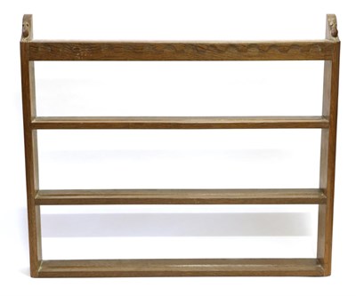 Lot 574 - A Robert  "Mouseman " Thompson Oak Open Delft Rack, three fixed shelves below a penny moulded...