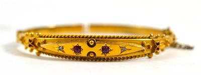 Lot 403 - A 9ct gold hinged bangle, cased