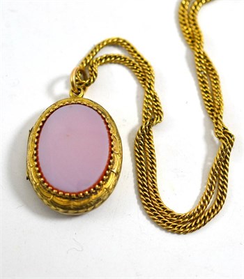 Lot 404 - Victorian yellow metal locket and chain