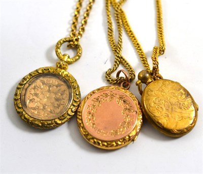 Lot 405 - Three Victorian lockets and chains