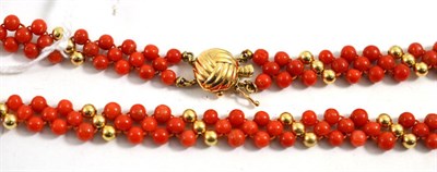 Lot 420 - Coral necklace, the clasp stamped '14K'