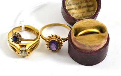 Lot 424 - A 22ct gold band ring, an amethyst ring, two stone set rings