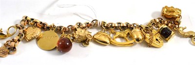 Lot 426 - A charm bracelet (a.f.) hung with twelve charms