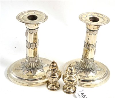 Lot 452 - A pair of loaded silver candlesticks and pair of silver pepperettes