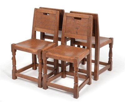 Lot 582 - A Set of Four Robert  "Mouseman " Thompson Burr Oak Panel Back Chairs, with aperture handle,...