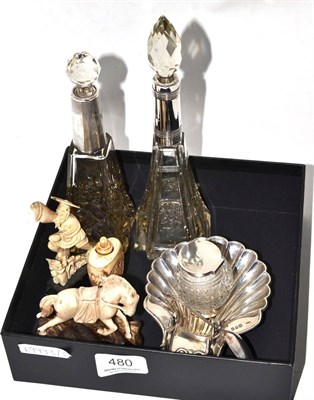 Lot 480 - Silver  ink-stand, two silver mounted scent bottles and three carved bone figures