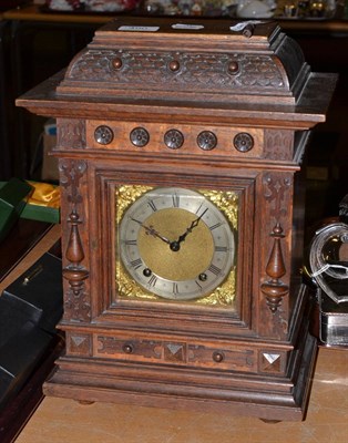 Lot 490 - A Victorian oak table clock and key