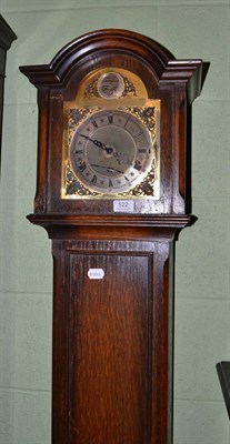 Lot 522 - Grandmother clock in an oak case, with key