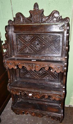 Lot 527 - Carved oak wall shelves dated '1688'