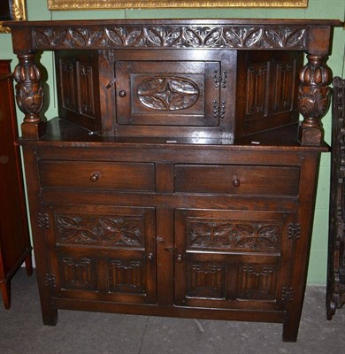 Lot 528 - Reproduction carved oak buffet