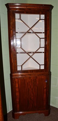 Lot 536 - A mahogany standing corner cabinet with glazed top