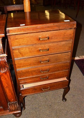 Lot 541 - Music cabinet, walnut circular table and an oak standard lamp