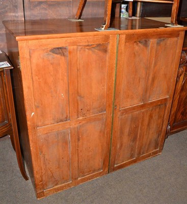 Lot 543 - A 19th century linen press with two doors enclosing drawers