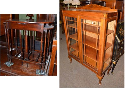 Lot 546 - Walnut glazed cabinet and a nest of three occasional tables