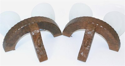 Lot 592 - A Pair of Robert  "Mouseman " Thompson Oak Double Wall Brackets, semi-circular design with two...