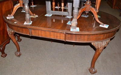 Lot 565 - Mahogany extending dining table on claw and ball feet