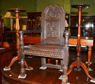 Lot 566 - An 18th century carved oak chair and two carved mahogany torcheres