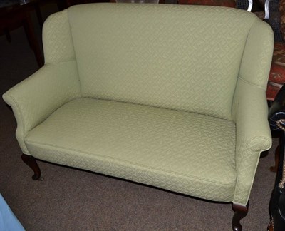 Lot 594 - A two seater Edwardian sofa with Colefax & Fowler upholstery