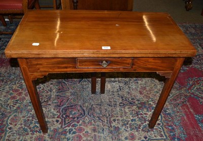 Lot 606 - A late Victorian mahogany inlaid fold-over tea table with single drawer