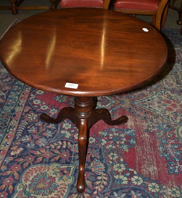 Lot 607 - A George III style mahogany tip-top table