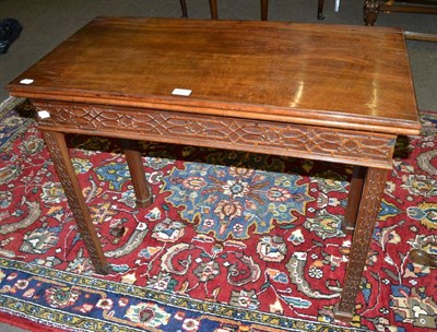 Lot 610 - A 19th century mahogany card table with blind fret carved detailing