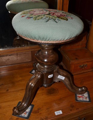 Lot 619 - Revolving piano stool with woolwork seat