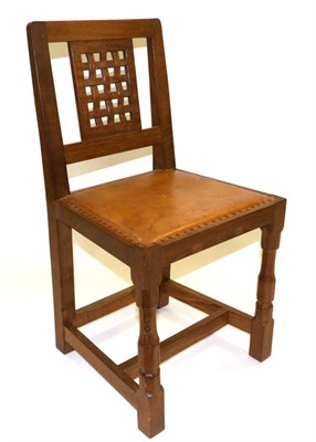 Lot 600 - A Robert  "Mouseman " Thompson Oak Lattice Back Dining Chair, with cow hide upholstered seat,...