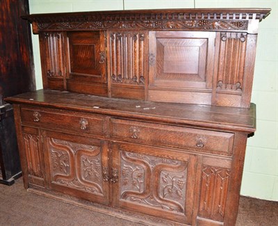 Lot 639 - Large Shapland and Petter of Barnstaple carved oak buffet