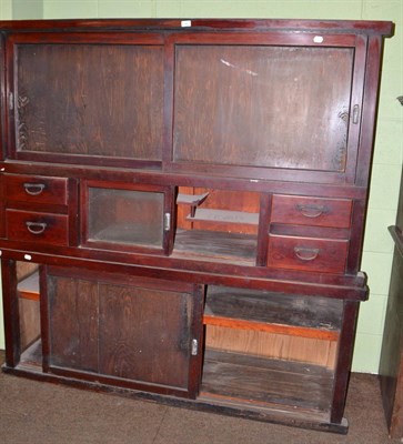 Lot 640 - A 20th century Japanese two part kitchen cabinet with sliding doors and drawers