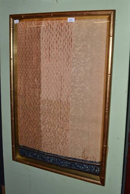 Lot 641 - Chinese silk skirt (part), framed in a gilt bamboo simulated frame