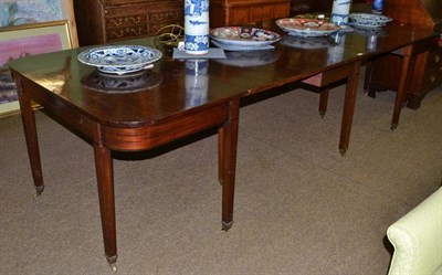 Lot 645 - Early 19th century large mahogany dining table with drop-leaf centre section