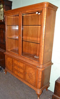 Lot 649 - A European walnut, satinwood and maple display cabinet