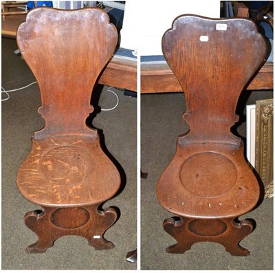 Lot 653 - Pair of Continental style oak hall chairs