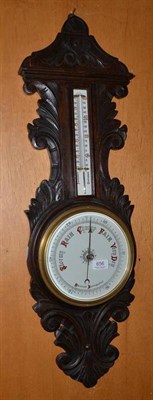 Lot 656 - A carved aneroid barometer