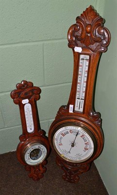 Lot 658 - An Edwardian oak barometer and another small barometer