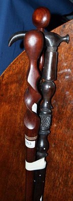 Lot 663 - Three African walking sticks