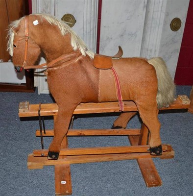 Lot 676 - Modern rocking horse on pine treadle base