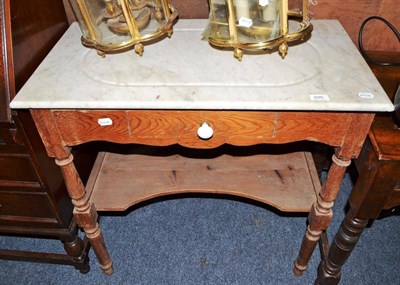 Lot 695 - A late 19th century French pine side table with detachable white marble top