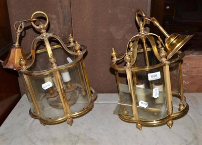 Lot 696 - Pair of brass hanging hall lanterns