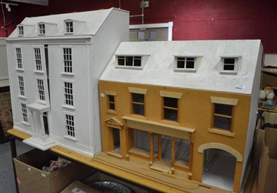 Lot 726 - Two partially constructed modern dolls houses, painted white with accessories including rolls...