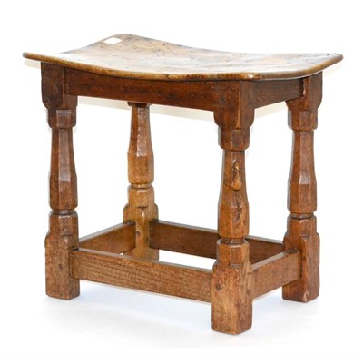 Lot 618 - A Robert  "Mouseman " Thompson Burr Oak Dish Topped Stool, on octagonal legs joined by...