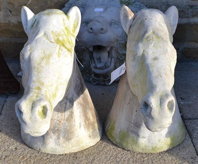 Lot 826 - A pair of horse head gate post pediments