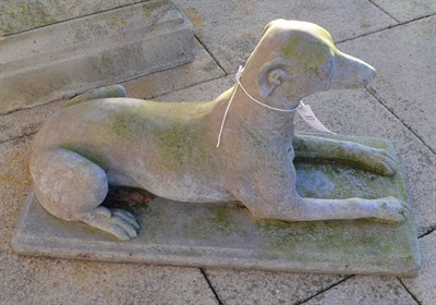 Lot 828 - A reconstituted stone greyhound