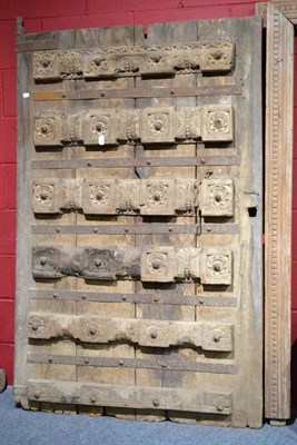 Lot 904 - An 18th century Bikaner, Rajasthan India courtyard door, decorated with horizontal bands and raised