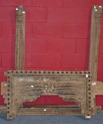 Lot 905 - A mid-16th century Indian palace door surround with carved header and supported on elaborate...