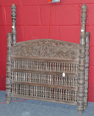 Lot 907 - Two circa 1810/1830 Karnataka India carved bed heads with elaborately turned spindles and rows...