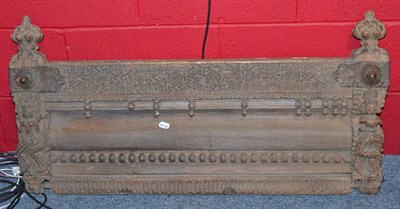 Lot 909 - An 18th century Gujarat India small teak balcony frontispiece carved with bands of horizontal...