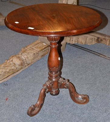 Lot 911 - A 19th century mahogany turned pedestal table on three carved feet, possibly made for Europeans...