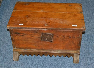 Lot 912 - A French 17th century chestnut low chest on sledge feet, with wavy carved front rail, original...