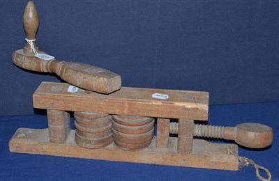 Lot 931 - A 19th century Cambridgeshire fruit wood wall hanging set of rollers, used to crush straw for...